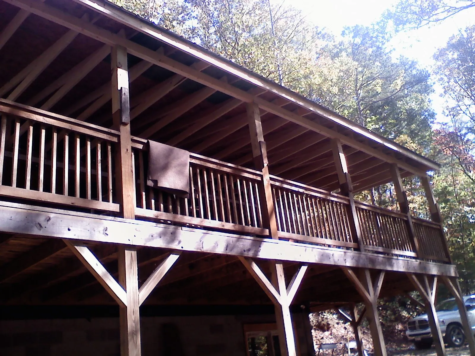 Timber framing under a new elevated porch and deck — Roof Leak Repair in Millis by Roofing Brothers
